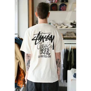 STUSSY CLASSIC GEAR TEE PIGMENT DYED เสื้อยืดแขนสั้นตัวอักษรผู้ชายครึ่งแขนสำหรับผู้ชายและผู้หญิง