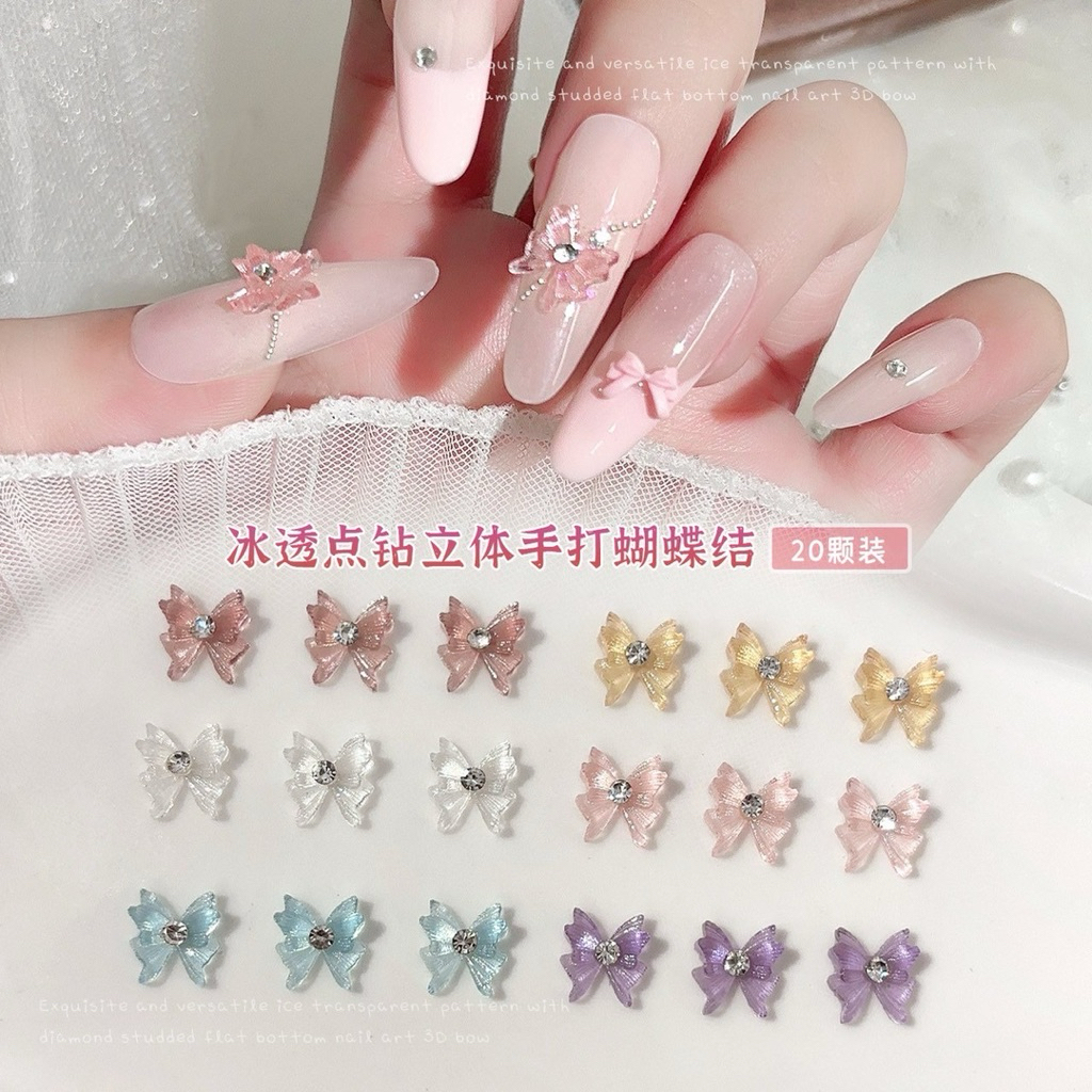 เรซิ่นโบว์ใสแต่งเพชร สำหรับแต่งเล็บ 20 ชิ้นต่อแพ็ค – โปรปัง
