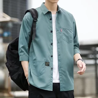 เสื้อเชิ้ตสีทึบของผู้ชายผ้านุ่ม และสบายโดยไม่ต้องรีดผ้าเสื้อเชิ้ตผู้ชายของเกาหลีเสื้อเชิ้ตฮาวายวันสงกราะห์