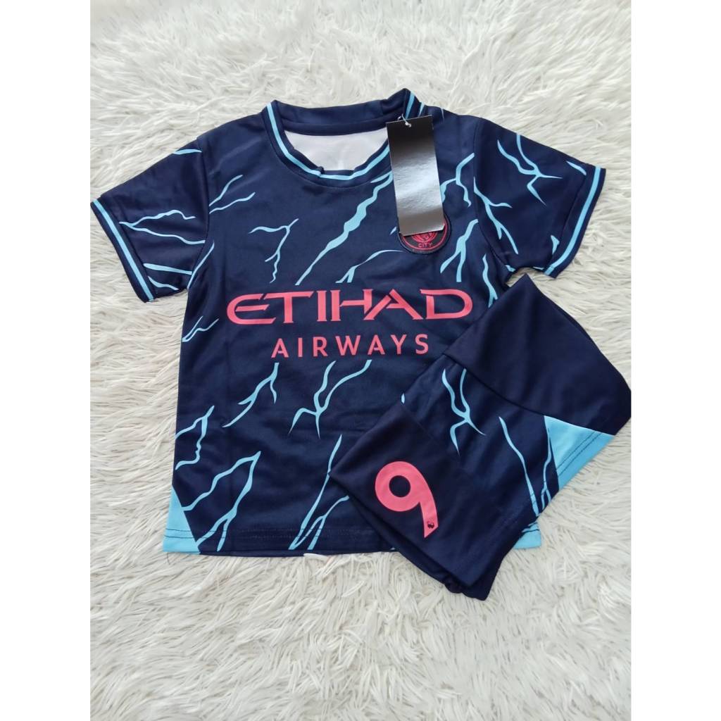 เสื้อบอลเด็ก(ชุดเยือน)แมนเชสเตอร์ซิตี้เบอร์9ชื่อฮาแลนด์ เสื้อ+กางเกง ปี2023