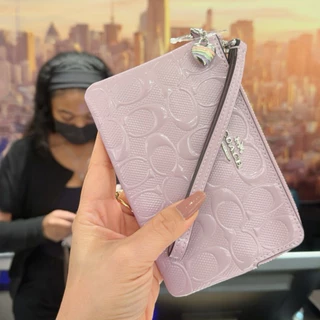 กระเป๋าคล้องมือ รุ่น Corner Zip Wristlet In Signature Canvas มีสีให้เลือก