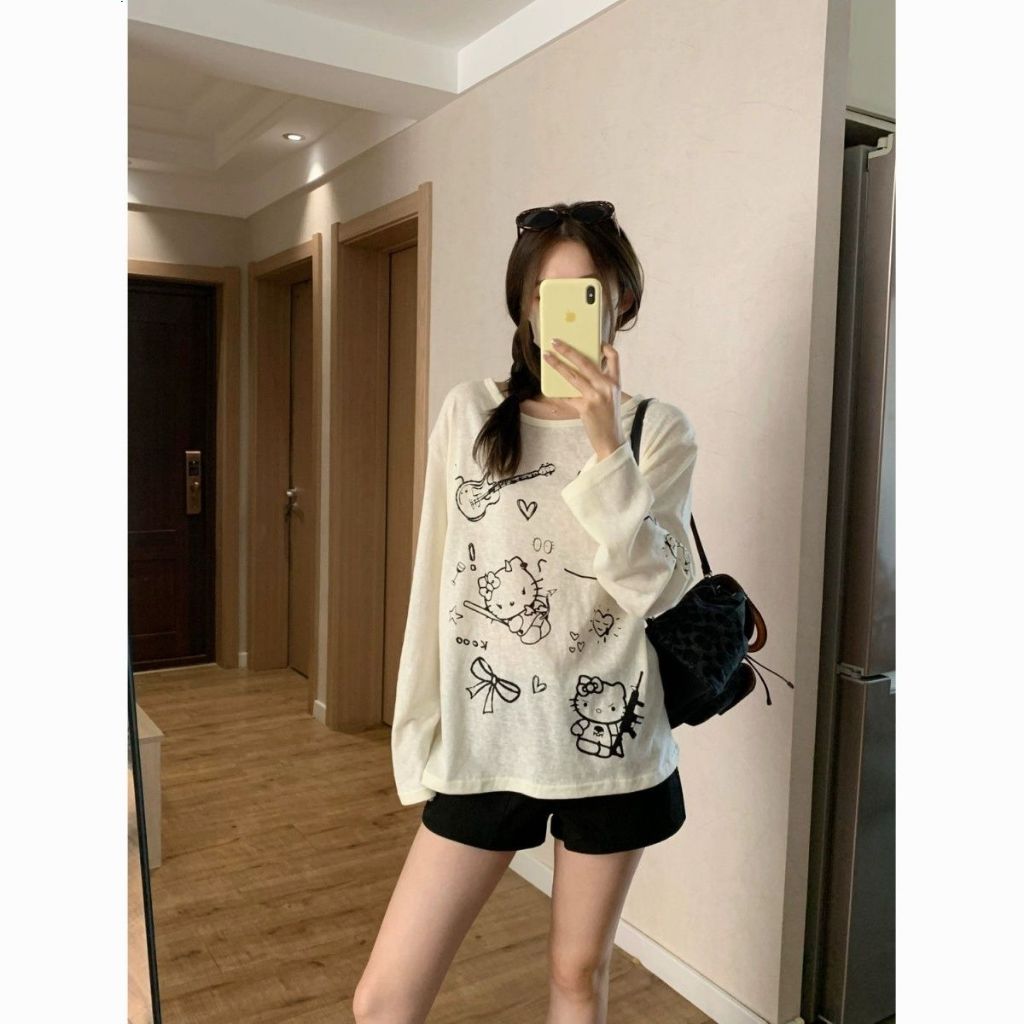 เสื้อยืดแขนยาวผู้หญิงสไตล์เกาหลีตัวนี้มีลายลูกแมวน่ารัก เนื้อผ้าใส่สบายและระบายอากาศได้ดี เหมาะสำหรับใส่ในฤดูร้อน