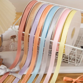ริบบิ้นโพลีเอสเตอร์ ขอบหยัก ขอบลูกไม้ สีพื้น หน้ากว้าง 1 CM