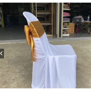 ผ้าคลุมเก้าอี้ พร้อมโบว์ต่วนสีทอง ผ้าสวมเก้าอี้ ผ้าคลุมเก้าอี้พลาสติก (รุ่นปกติจีบข้าง) ใช้สำหรับงานพิธี งานแต่ง อื่นๆ