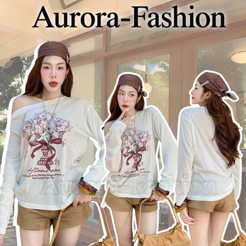 Aurora🛒พร้อมส่ง🚚 (รูปถ่ายจากงานจริง) เสื้อยืดแขนยาว คอกลม สีขาว ดีเทลซีหรูเบาๆสกีนลาย