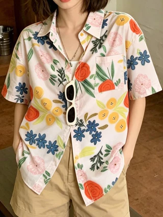 เสื้อเชิ้ตลายดอก ผ้าบาง ทรงหลวม สไตล์ฮาวาย ย้อนยุคฮ่องกง รุ่นใหม่ฤดูร้อน 2026 เหมาะใส่เที่ยวชายหาด สำหรับผู้หญิง
