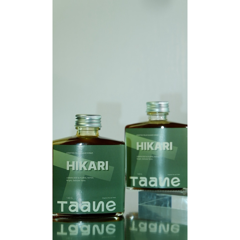 TAANE HIKARI ไซรัปจากน้ำตาลโตนด ผสมเลม่อน (ขวดเขียว)