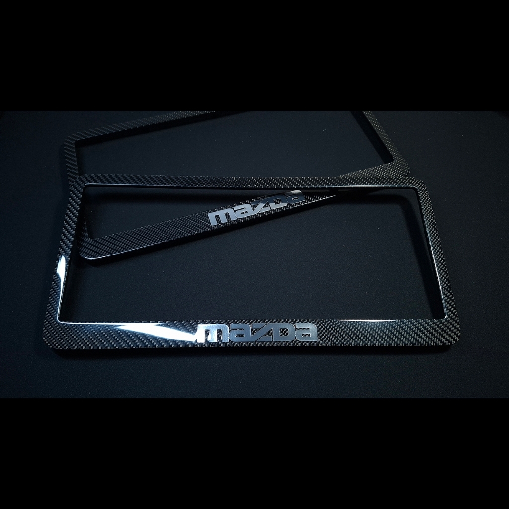 กรอบป้ายทะเบียน รถยนต์ Mazda หุ้มคาร์บอนแท้ ลาย2 จำนวน1คู่ (สินค้าพร้อมส่ง ไม่ต้องรอ)