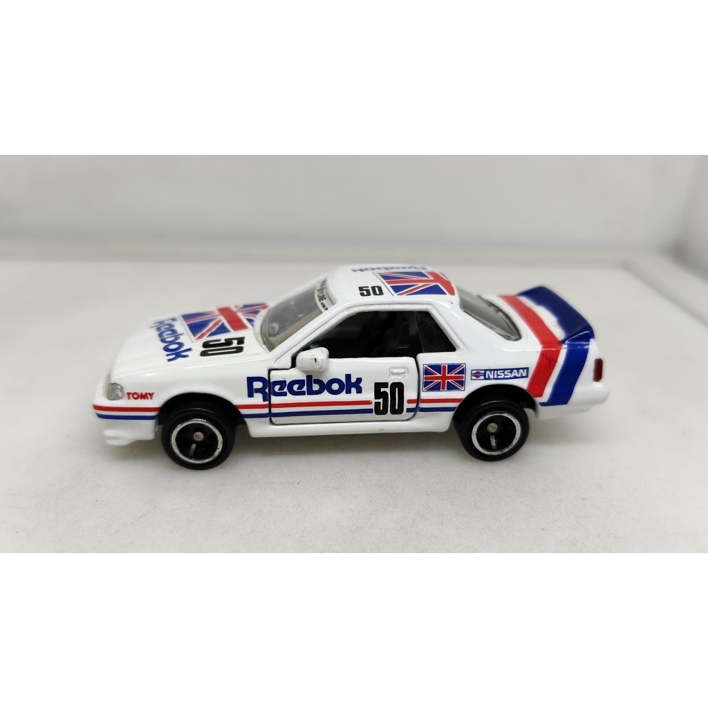 🔵🔵UN01โมเดลรถเหล็ก TOMICA 50th Anniversary HASEMI MASAHIRO Reebok Nissan skyline GT-R R31