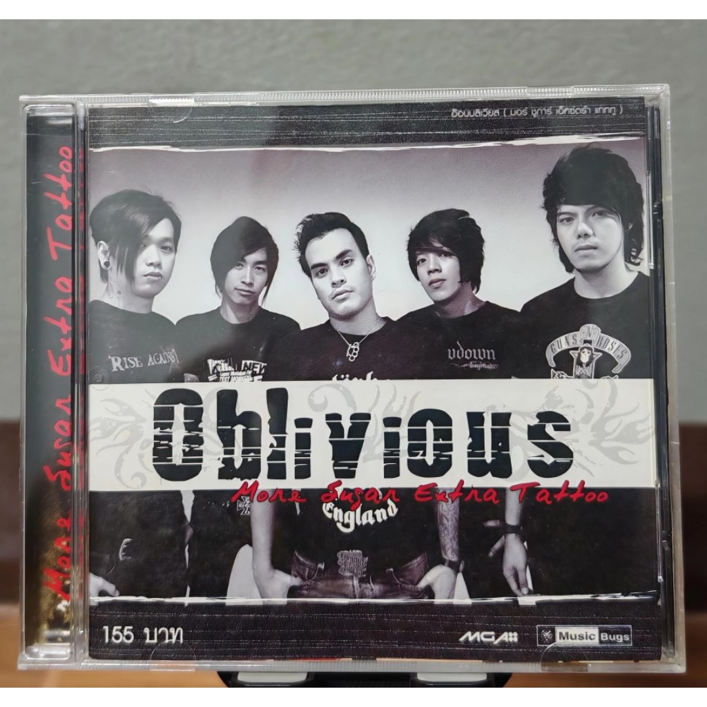 CD Oblivious อัลบั้ม More Sugar Extra Tattoo (มือ2),แผ่นมีรอย แต่ยังสวย เทสแล้วฟังได้ปกติ