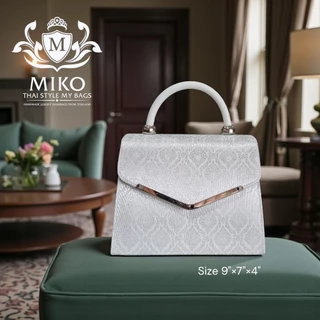 Miko กระเป๋าถือ สีบรอนซ์เงิน และสีออฟไวท์ สีขาว ผ้าไทย