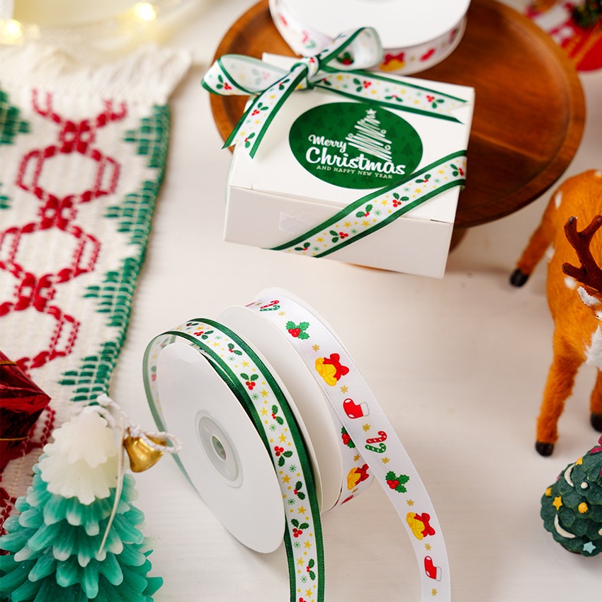 ริบบิ้นซาตินลายธีมคริสต์มาส Merry Chrismas Mixed กว้าง 1.5 cm (ยาว 22 เมตร)