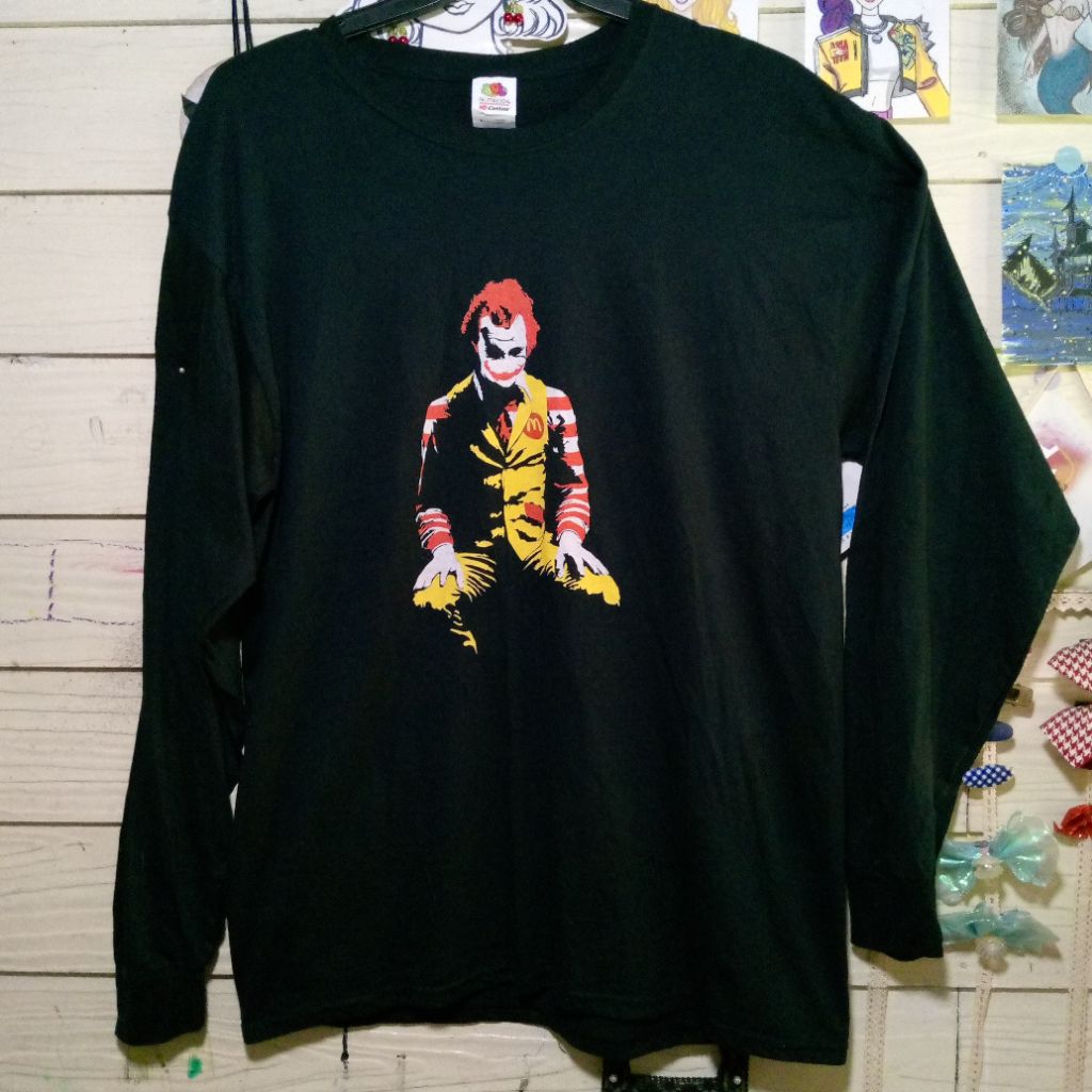เสื้อแขนยาวสีดำ ลายโจ๊กเกอร์สตรีท Joker/McDonalds⚫🟡🟠🔴อก44 ใส่เท่ๆลายไม่ซ้ำใคร