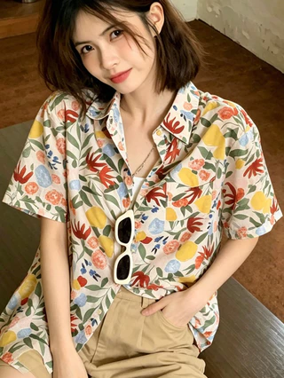 เสื้อเชิ้ตลายดอก ผ้าบาง ทรงหลวม สไตล์ฮาวาย ย้อนยุคฮ่องกง รุ่นใหม่ฤดูร้อน 2026 เหมาะใส่เที่ยวชายหาด สำหรับผู้หญิง