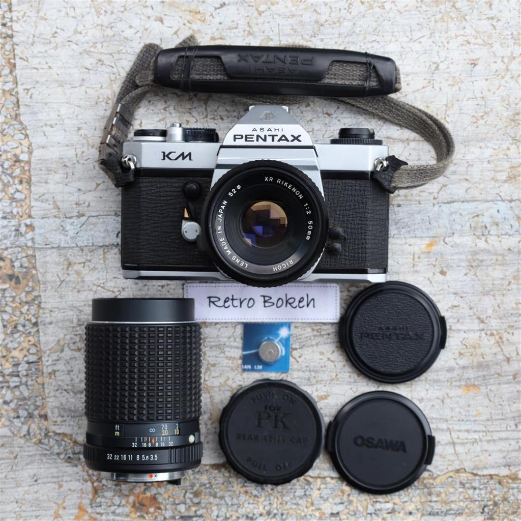 กล้องฟิล์ม PENTAX KM + เลนส์ฟิกซ์ Ricoh XR  50mm F2 + เลนส์ 75-150mm F4 + สาย + แบต + ฝา ได้ครบชุด