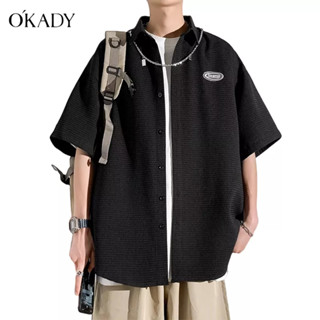 OKADY ใหม่ ins ฤดูใบไม้ผลิเสื้อเชิ้ตประจำวันของผู้ชายวรรณกรรมเยาวชนอารมณ์ยอดนิยมแขนห้าส่วนที่เรียบง่าย