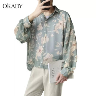 OKADY ผู้ชาย ins Hong Kong เสื้อเชิ้ตลายดอกทรงหลวมอินเทรนด์เวอร์ชั่นเกาหลีหล่อส่วนบางเสื้อเชิ้ตแขนยาวพิมพ์ลาย