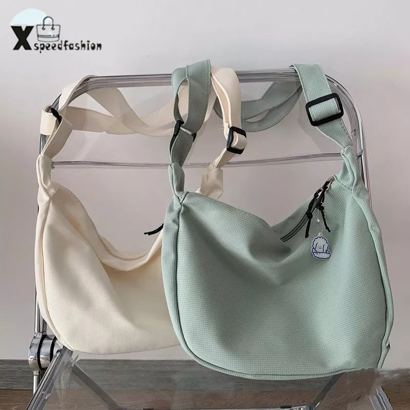 xspeedfashion(X1833) กระเป๋าสะพายข้างผ้าไนล่อนสีพื้นลายเส้น สไตล์เกาหลี(ไม่มีที่ห้อยแถม)