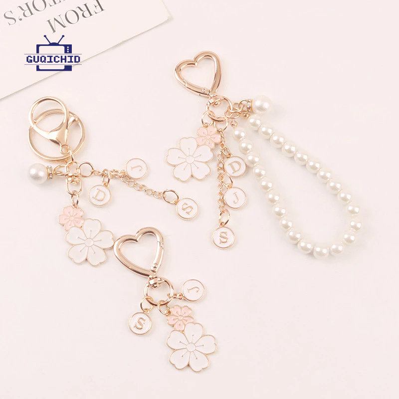 สายคล้องโทรศัพท์มือถือ จี้โทรศัพท์โลหะรูปดอกไม้คู่ จี้กล่องหูฟังไข่มุกตัวอักษรน่ารัก จี้กระเป๋าสุดสร้างสรรค์ พวงกุญแจ - รูปที่ 7