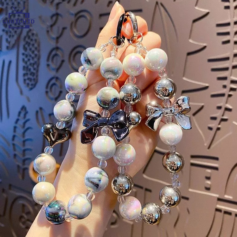 สายคล้องโทรศัพท์มือถือไตล์สั้นสายรัดข้อมือโบว์โบว์สร้อยข้อมือลูกปัดแฮนด์เมดจี้เชือกเส้นเล็ก Anti-Lost ccdเชือกคล้อง
