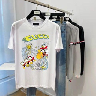 Gucci 2023 ใหม่ เสื้อยืดคอกลม แขนสั้น พิมพ์ลายการ์ตูนเป็ดโดนัลด์ แฟชั่นฤดูใบไม้ผลิ และฤดูร้อน สําหรับผู้ชาย และผู้หญิง