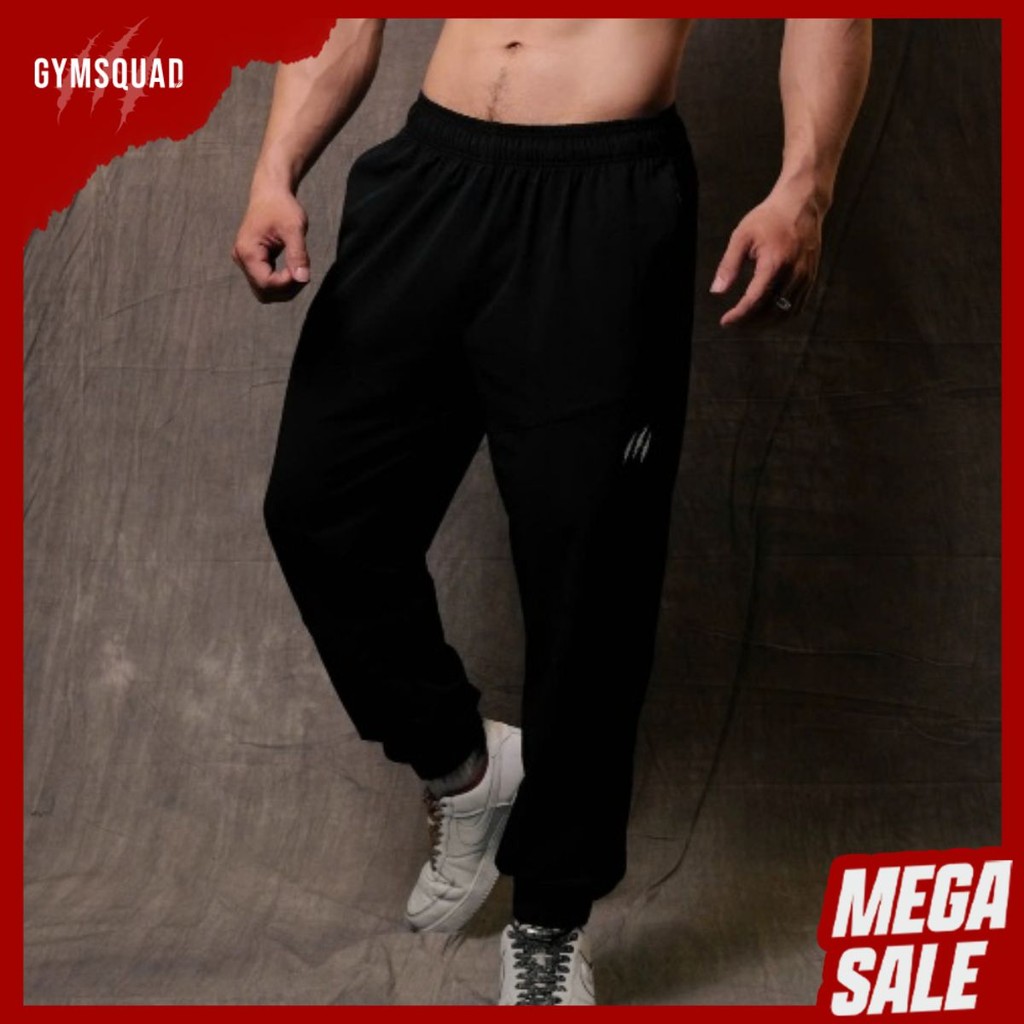 Beast GYMSQUAD Joggers กับ Breathable ยืดร่มชูชีพผู้ชายกีฬายิมเดินป่า Joggers สีดํา