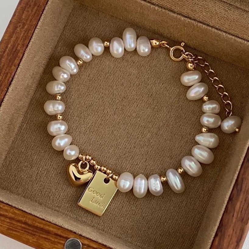 สร้อยข้อมือมุกผิดปกติ 7 มม. พร้อม Lucky Lucky Charm - Truong Thinh Pearl