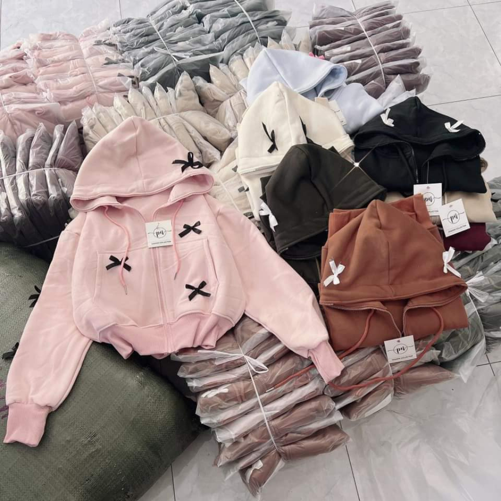 เสื้อแจ็คเก็ตผ้าฟลีซยาวปานกลางสําหรับผู้หญิงฟรีไซส์ภายใต้ 55 กก. มีฮู้ดสองชั้นแบบหนาซิปมีโบว์