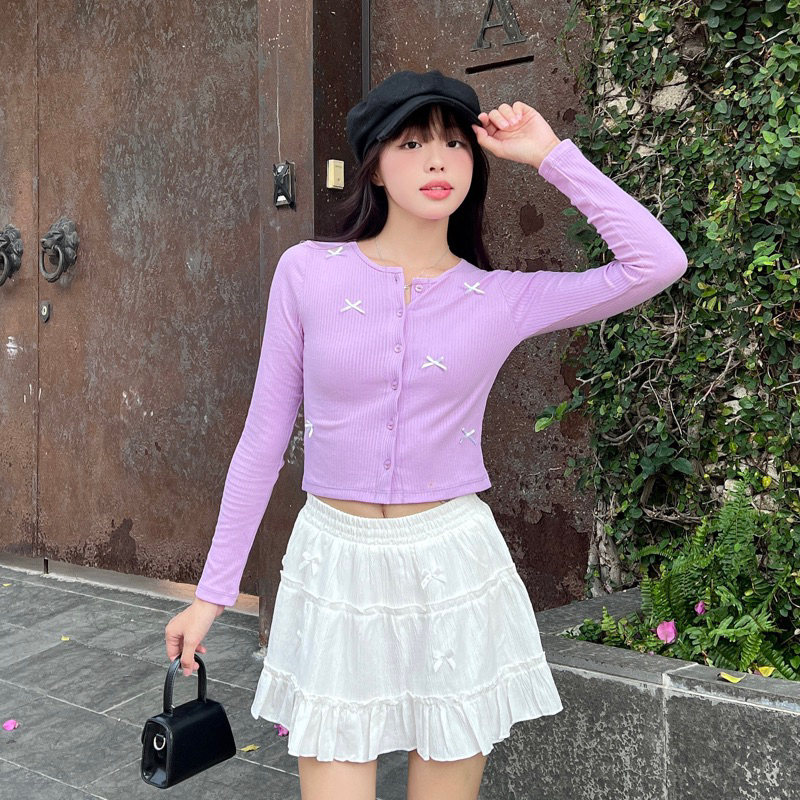 เสื้อคาร์ดิแกนแขนยาวยาวปานกลางมีโบว์สุ่ม | แบรนด์ Moodie