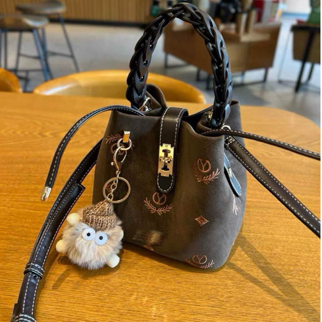 Yichen - Drawstring Bucket Bag with Crossbody Strap and Cotton charm