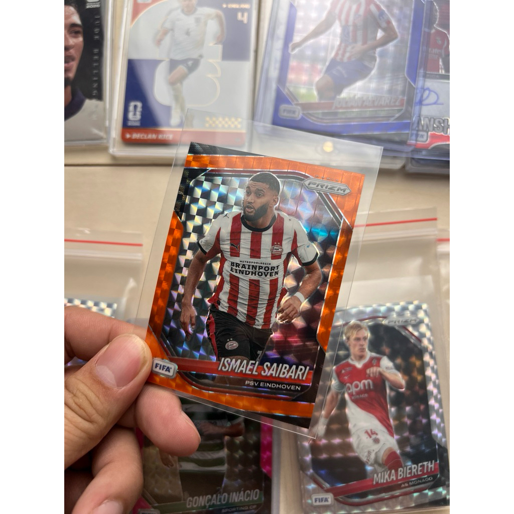การ์ดเครื่องเล่น Ismael Sabari - ขนานพร้อมเลข - Panini Prizm Fifa Soccer 2026 - Orange Mosaic 188/29