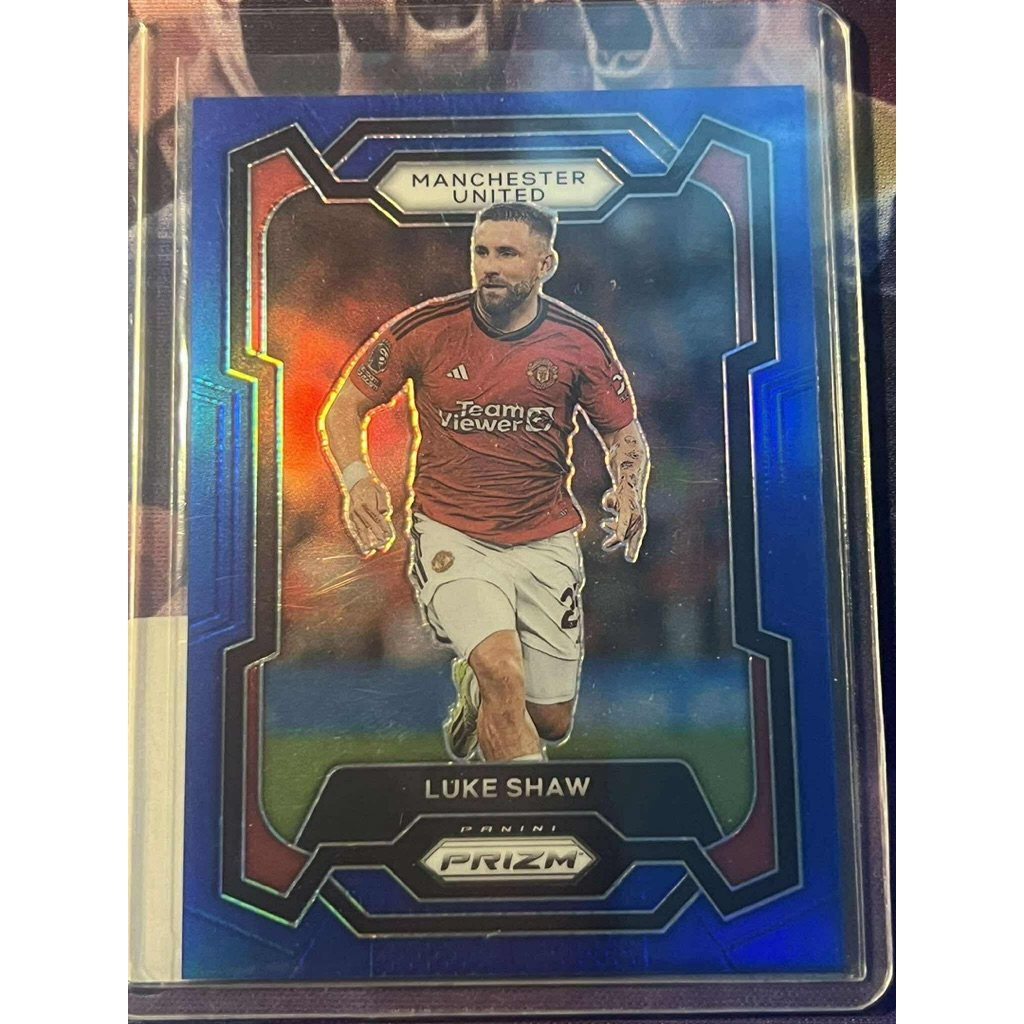 การ์ดฟุตบอลลิมิเต็ด N14 Luke Shaw แมนเชสเตอร์ ยูไนเต็ด น้ําเงิน เงิน /299 Panini Prizm EPL 2023/24