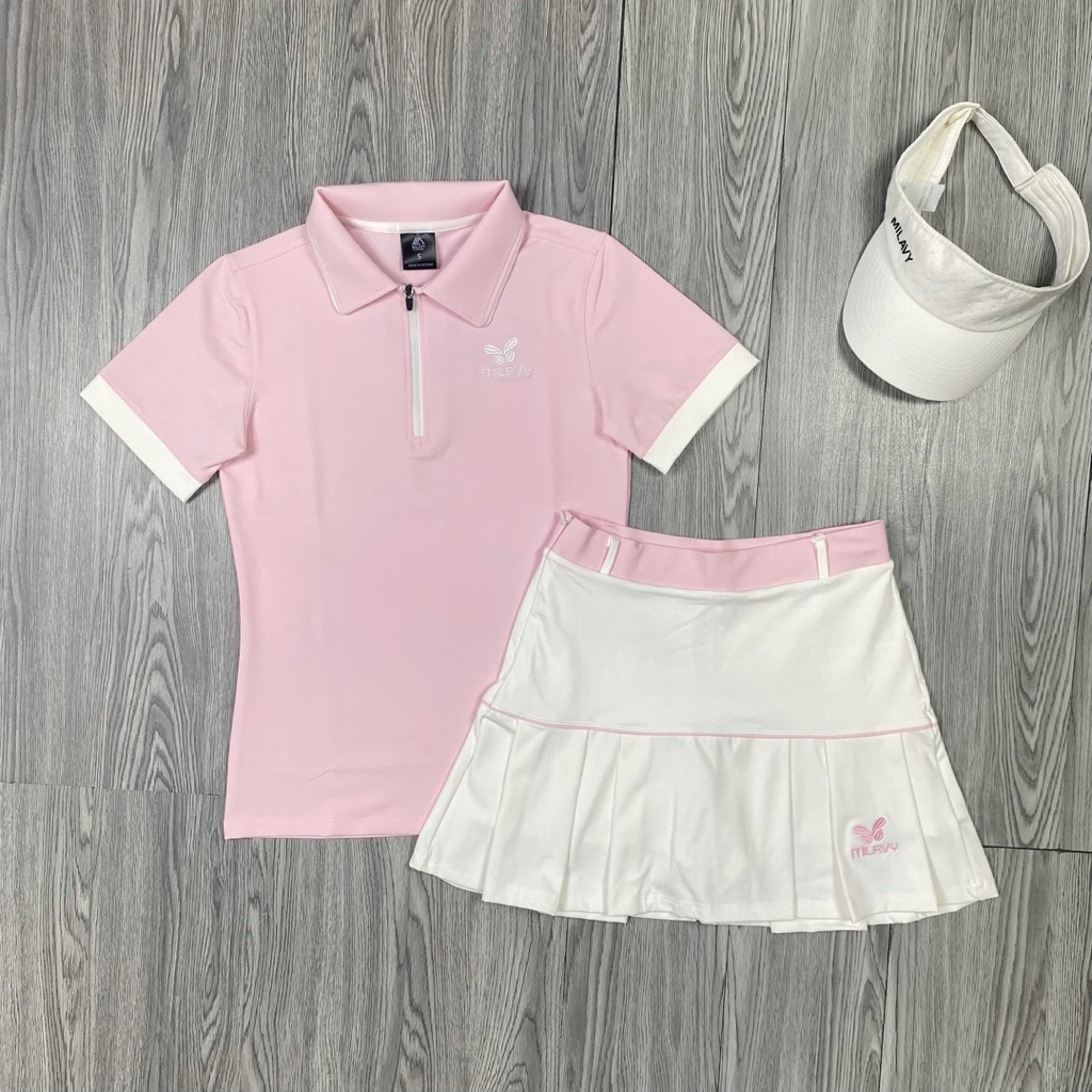 MILAVY LILY ชุดชุดกีฬาผู้หญิงกระโปรงซิป 2 ชั้นพร้อมเสื้อคอเต่าผ้ายืดหยุ่นแท้ที่สวยงามพร้อมโลโก้ปัก -