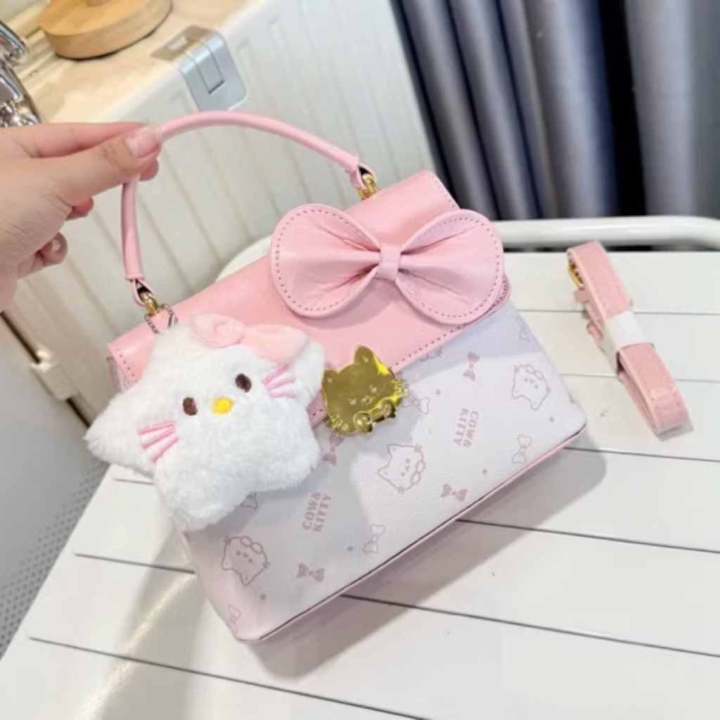 กระเป๋าถือสตรีพิมพ์ลาย helokitty และรูปดาวสุดน่ารักที่พอดีกับโทรศัพท์และลิปสติกได้อย่างสะดวก TT68TK